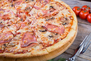 Whole baked pizza with bacon