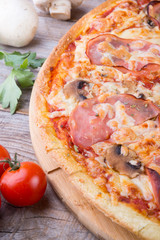 Whole baked pizza with bacon