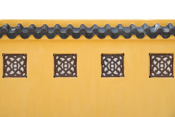 Yellow concrete fence wall with roof in chinese exterior style