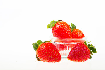 Bright red strawberries against a white background