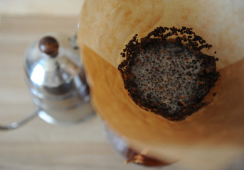 Coffee brewed in the filter paper. Drip Coffee Maker.