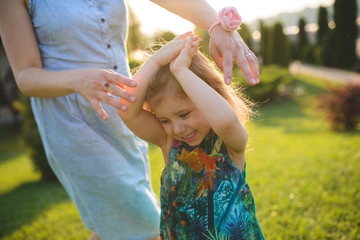 Obraz premium Dancing Family in Sunlight