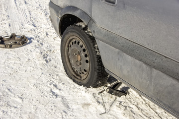 flat tire in the winter snow