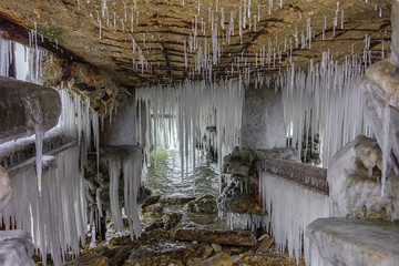 many exciting icicles under the old abandoned bridge