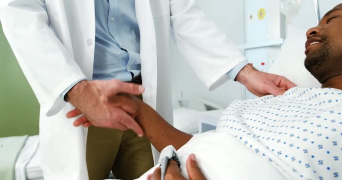 Doctor shaking hands with patient in the hospital