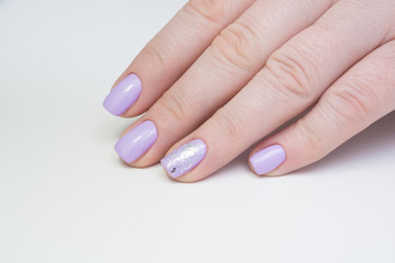 Beautiful natural nails, hand and ideal clean manicure. Decorated with stylish elements