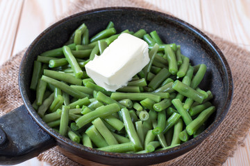 Green beans in a pan with butter
