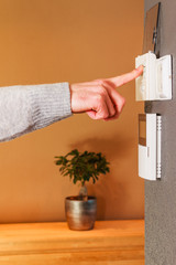 Man pushing button home appliance