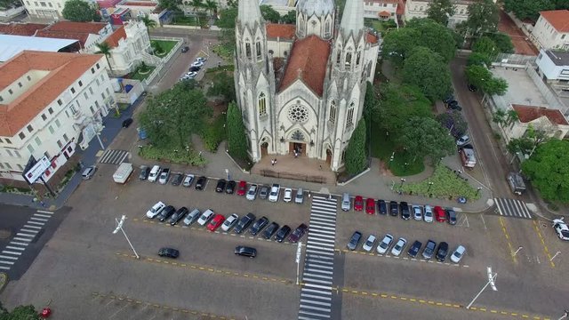 Aerial video from the mother church revealing the city of Botucatu - S&atilde;o Paulo, Brazil - at sunset