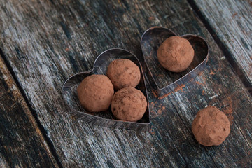 Truffle chocolate candies on cocoa powder