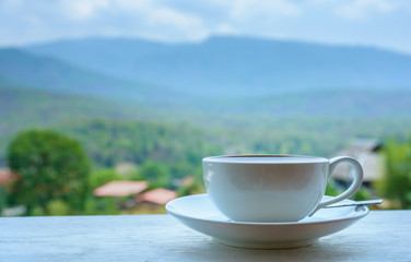 Hot coffee in cool tone morning light.