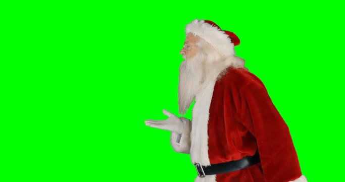 Santa claus giving flying kiss on green screen 4k