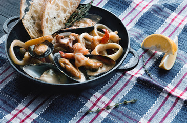 Seafood Stew in Saucepan, italian restaurant cuisine closeup