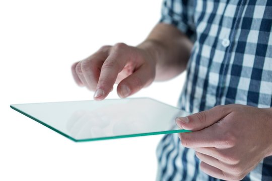 Mid section of man using futuristic digital tablet