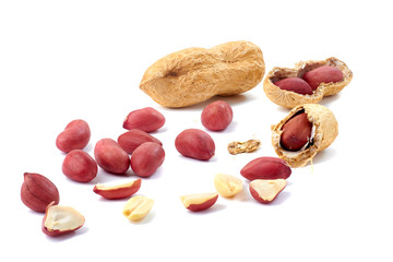 Heap of peanuts whole and shelled on white