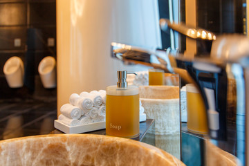 Liquid soap bottle on the bathtub in modern bathroom at home, hotel