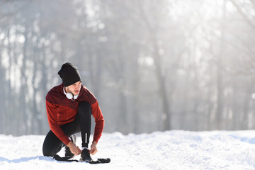 Man Sportsman Taking Break From Running in Extreme Snow Conditions