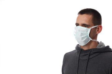 Portrait of man wearing facial hygienic mask outdoors. Ecology, air pollution, Environmental awareness and virus protection concept