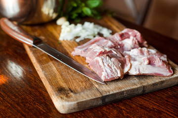 Raw fresh Lamb Meat ribs and seasonings on wooden background.