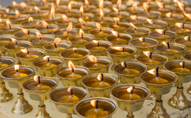 oil lamp, Burning candles in Buddhist temple. 