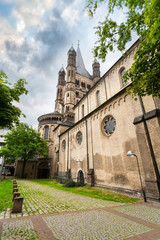 Fototapeta na wymiar Great st. Martin church and patio with greenery in Cologne, Germany