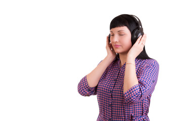 Fototapeta premium Girl with headphones listening to music on a white background