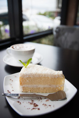 Coffee. Cappuccino. White cup. Cakes.