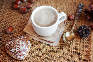 Coffee with milk on a cloth from a canvas. Selective focus