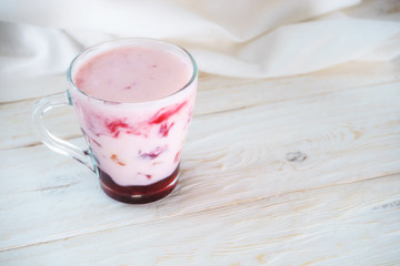 glassful smoothie with yogurt and jam