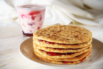 pancakes with jam and glass of smoothies