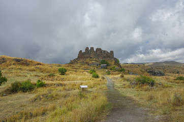 Fototapeta na wymiar Amberd fortress in slope of Aragats mountain in the clouds. Armenia