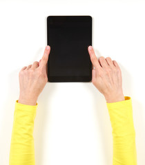 Hands in yellow jacket and black tablet