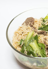 delicious instant noodle in bowl on white background