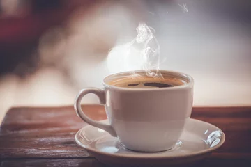 Zelfklevend Fotobehang hot fresh coffee on desk work © mrpuiphotography