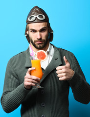 Fototapeta premium bearded pilot with cocktail in glass