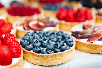Closeup of blueberry tart dessert tray assorted