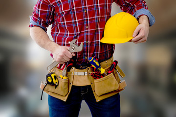 constructor with helmet and tools