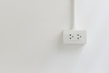 Plug on white wall