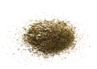 Pile of dried oregano leaves isolated on white background