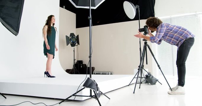 Female model posing for fashion shoot in studio 4k