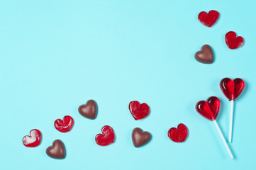 Chocolate candies and red lollipops.The form of hearts. Love concept. Valentine day.
