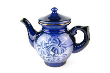 Blue ceramic teapot on a white background.