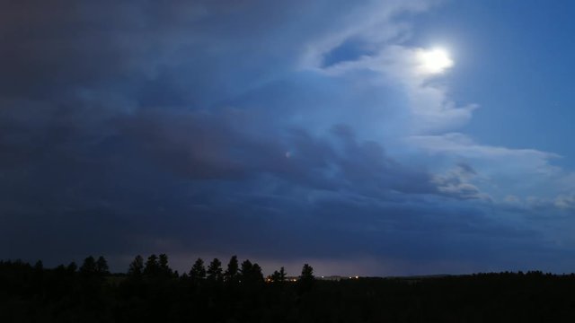 Thunderheads with Lightning Give Way to Full Moon