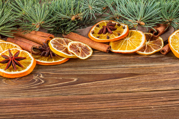 Dried oranges, star anise, cinnamon sticks and gingerbread on a wooden background -- Christmas still life background