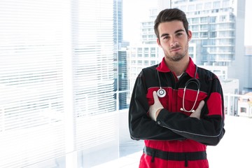 Portrait of handsome paramedic with his arms crossed