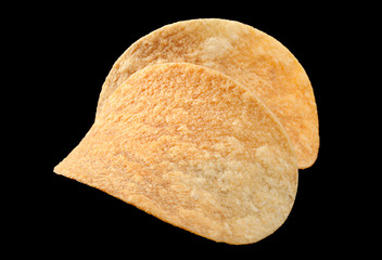 Potato chips on black