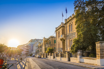 Naklejka premium Msida, Malta - Beautiful sunset at the old streets of Msida, the central city of Malta with blue sky