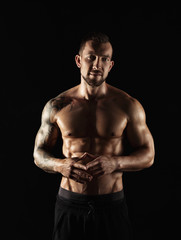 Fototapeta premium Strong athletic man showes naked muscular body