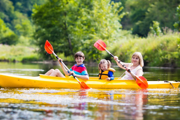 Family enjoying kayak ride on a river