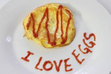 Image of Omelette with Ketchup and I LOVE EGGS written on plate